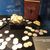 The image shows a display case with concreted silver US half dollars from 1850-1860, a book titled 'SS Republic' and some individual coins and coin clusters, suggesting a historical or marine treasure exhibition.