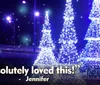 A child in a Santa hat looks longingly out of a window at night towards a brightly lit Ferris wheel with the caption Absolutely loved this - Jennifer