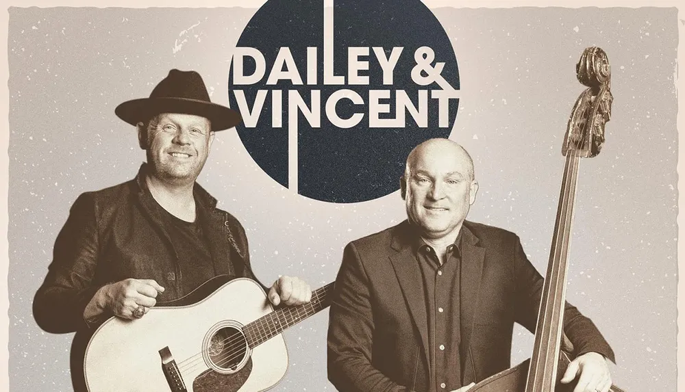 The image shows two smiling men with musical instruments one holding a guitar and the other holding an upright bass standing in front of their bands name logo DAILEY  VINCENT